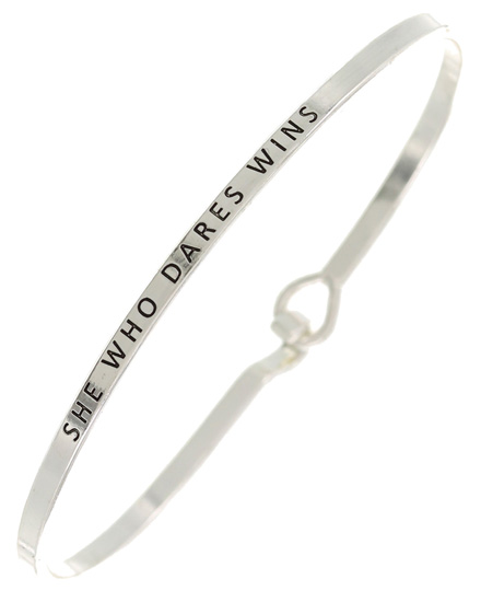 SHE WHO DARES WINS