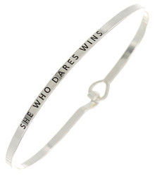 SHE WHO DARES WINS